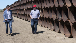 Keystone XL President Richard Prior, left, celebrated the start of construction in Alberta in July 2020.