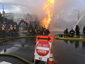 In this photo taken Feb. 6, 2019, firefighters and PG&amp;E employees, respond to the natural gas-fueled fire that erupted after a pipeline branch connection was damaged during excavation. Photo courtesy of PG&amp;E
